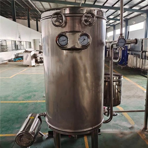 Stainless steel UHT sterilization tank with jacketed vessel and PLC control panel in a food processing plant