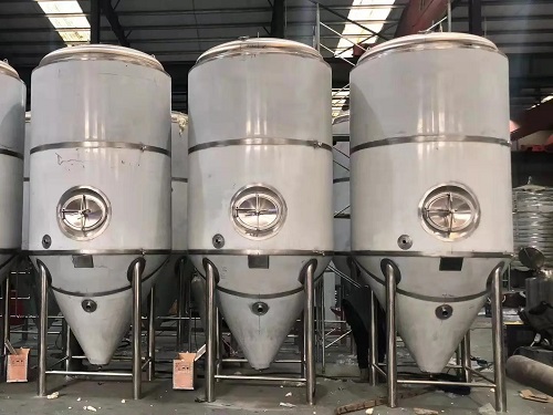 A 316L stainless steel bright beer tank with a cooling jacket in a brewery
