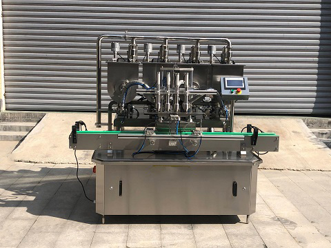 4-head paste filling machine model GT-4T with piston metering filling four bottles atonce