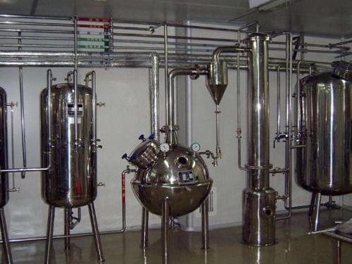 Spherical concentrator installed in a production line with piping and vacuum ports